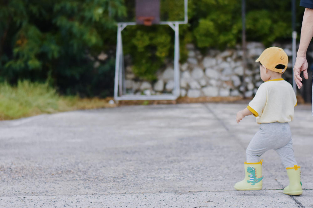 Kid outside in potty training undies
