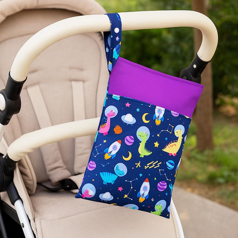 Dino DuoDry Wet Bag attached to a stroller. 
