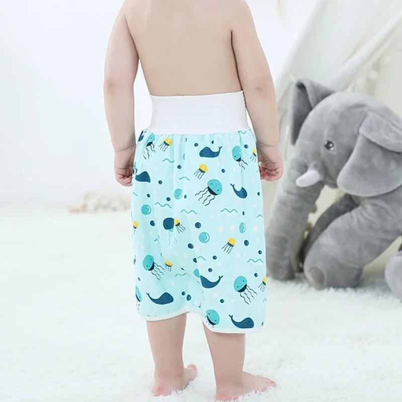 Little boy wearing absorbent potty training DreamWear pants. 