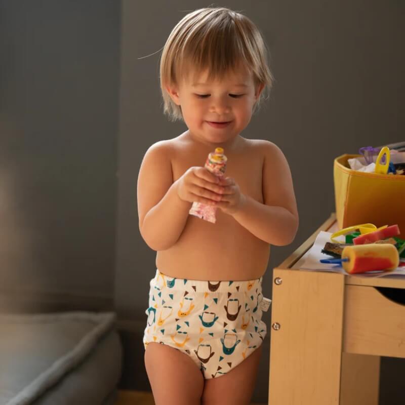 Toddler wearing absorbent Loondie Potty Undies with a Penguin print. 