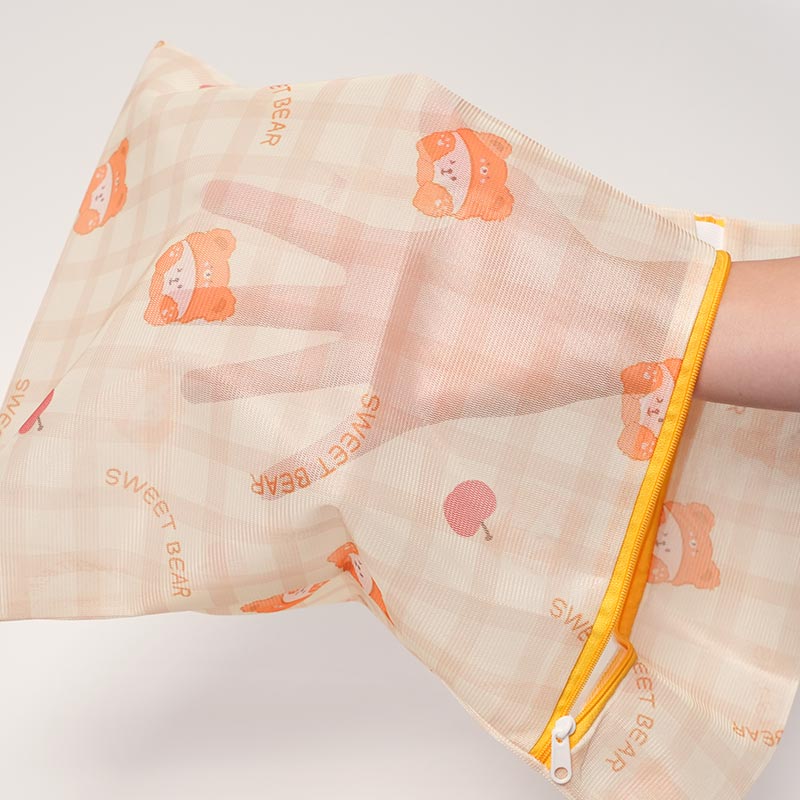 Mesh bag designed to protect potty training pants and other small clothes during machine wash. 