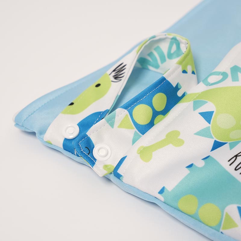 Close up on the buttoned latch of the DuoDry Wet Bag.