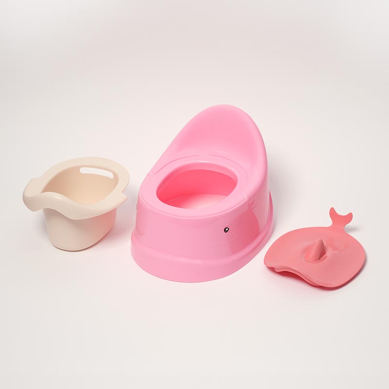 Pink whale-shaped potty for toddlers, with a white chamber pot and a closing lid. 