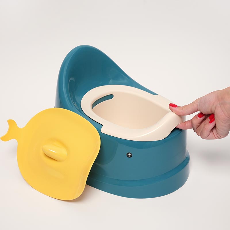 Woman's hand interacting with the Easy Clean Potty.