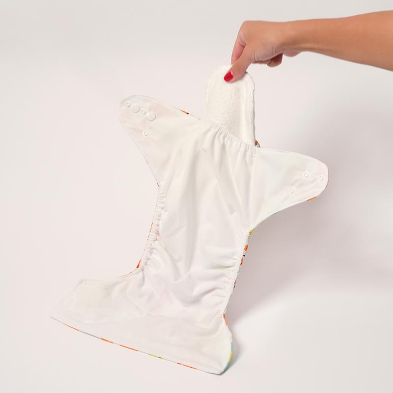 Woman holding Protect Plus Undies with an absorbent insert added into it. 