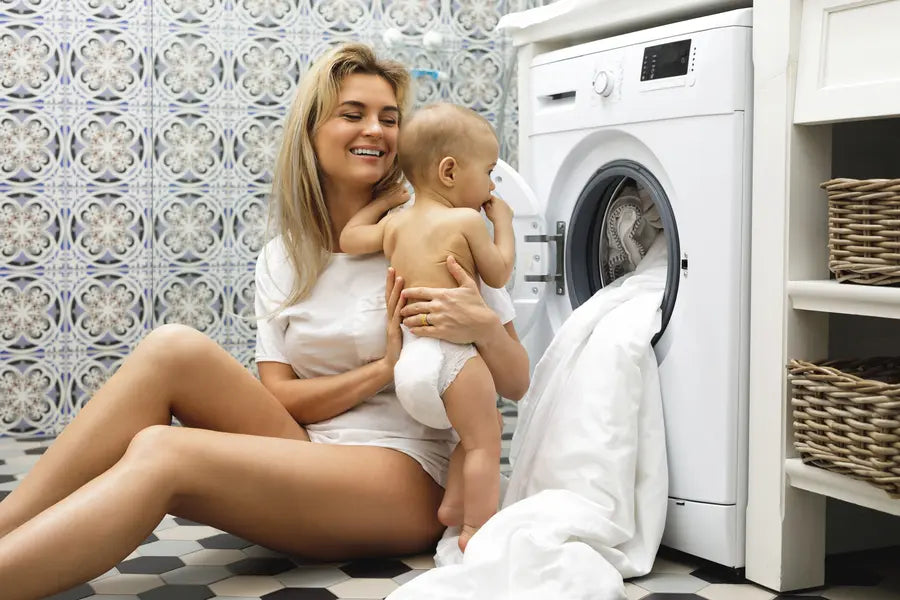 Parent with kid doing laundry