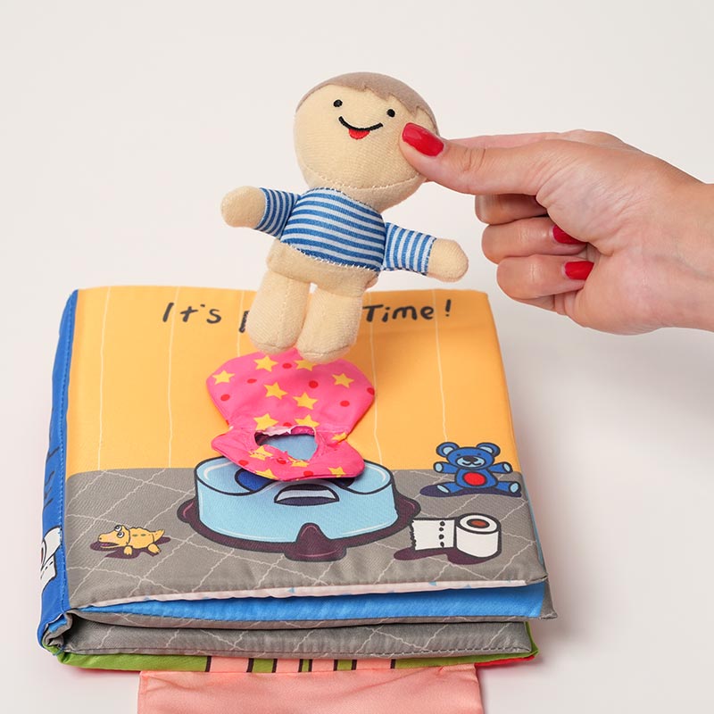 Removable little boy soft toy featured on the cover of the Loondie Potty Buddy Book. 