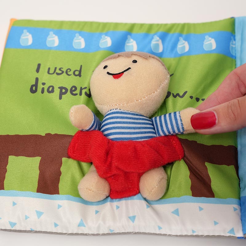 Close up on the soft, interactive book for kids designed to teach potty training. 