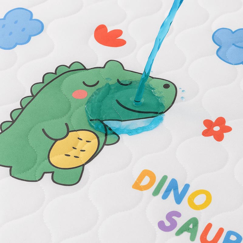 Close up on a blue liquid poured onto a leak-proof Waterproof Dream Mat.